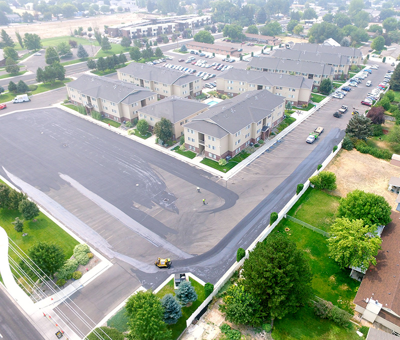 A large commercial apartment complex having their parking lot seal-coated..